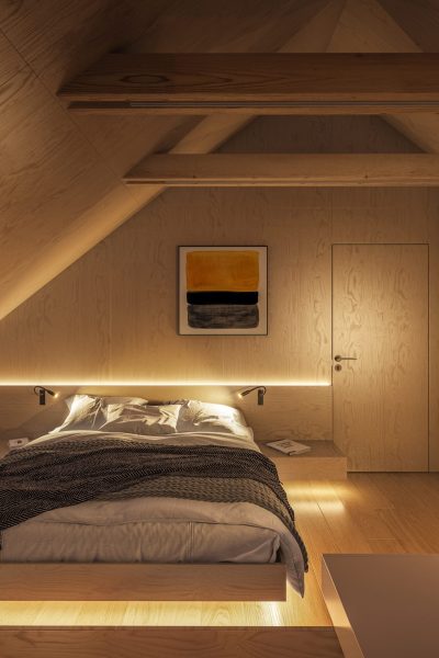 Interior of a modern plywood bedroom at night showcase